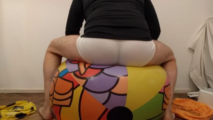2c | Sit to pop big beach ball on the floor in white underwear | reventemos.com