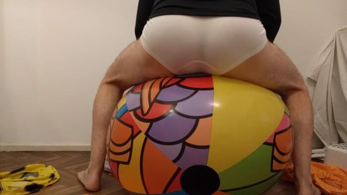 2d | Sit to pop big beach ball on the floor in white underwear | reventemos.com