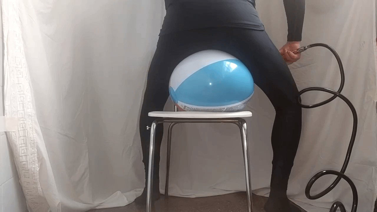 Air compressor + sit popping beach balls in leggings on a chair
