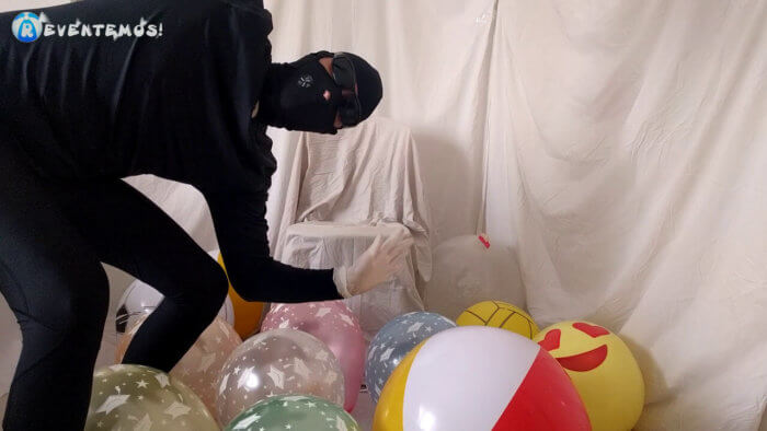 701 . Sit popping small balloons on a chair in leggings
