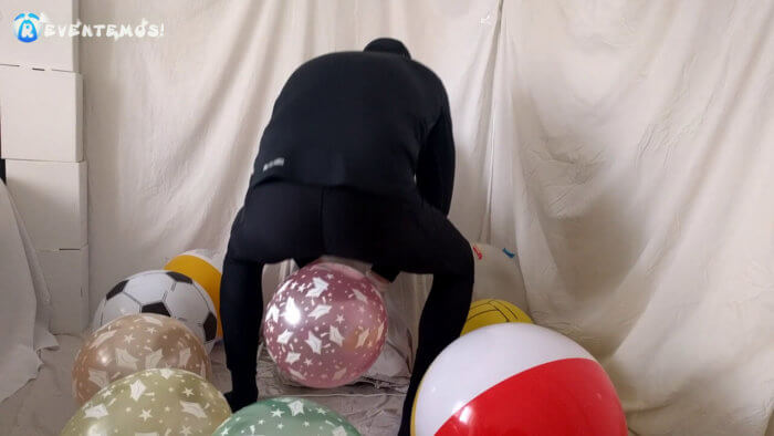 708 . Sit popping small balloons on a chair in leggings