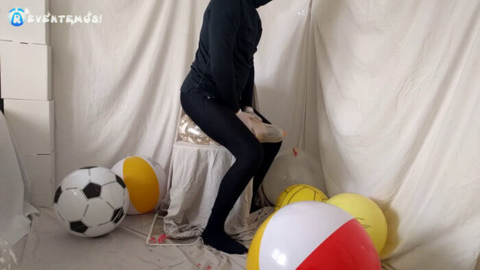 709 . Sit popping small balloons on a chair in leggings