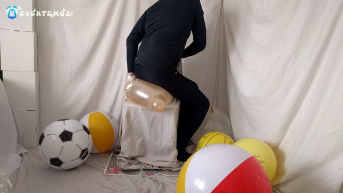710 . Sit popping small balloons on a chair in leggings