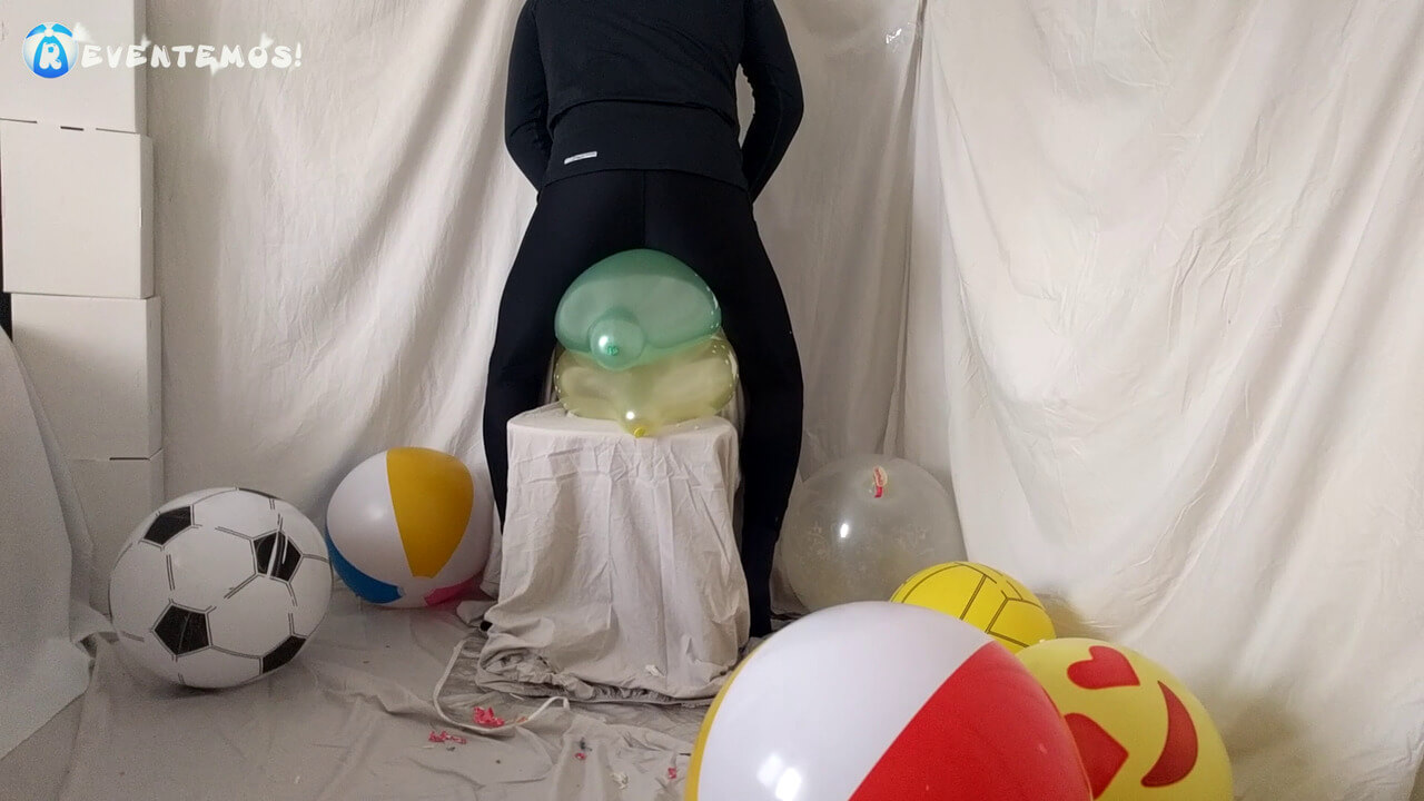 Sit popping small balloons on a chair in leggings