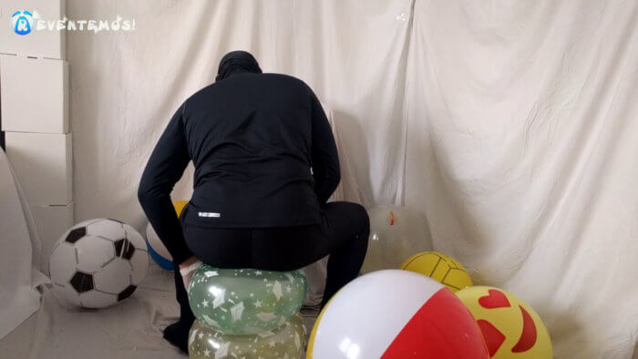 715 . Sit popping small balloons on a chair in leggings
