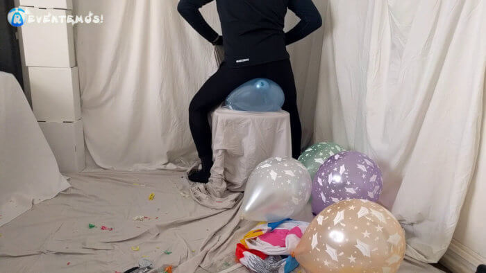 716 . Sit popping small balloons on a chair in leggings
