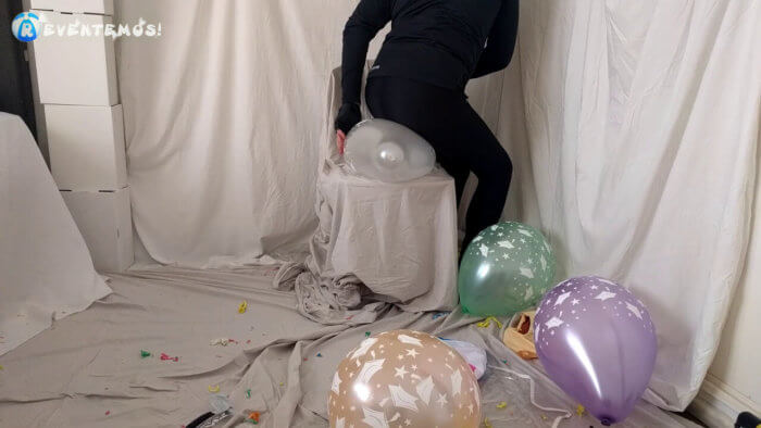 717 . Sit popping small balloons on a chair in leggings