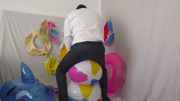 811. Sit popping beach balls in a suit after work