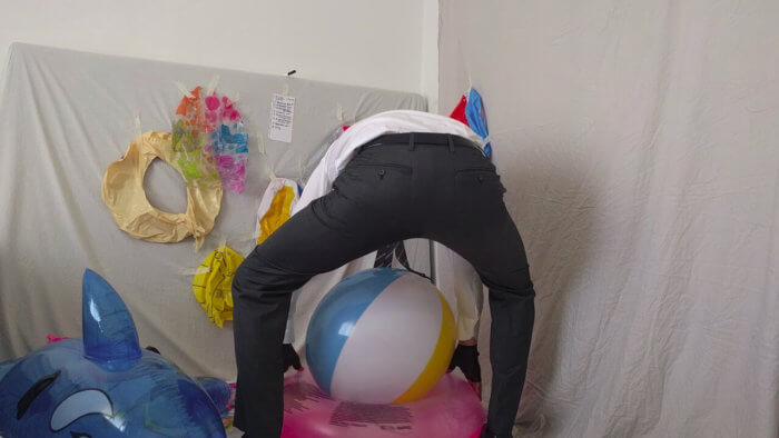 816. Sit popping beach balls in a suit after work