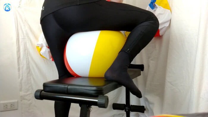 910. Sit popping and deflating beach balls on a workout bench
