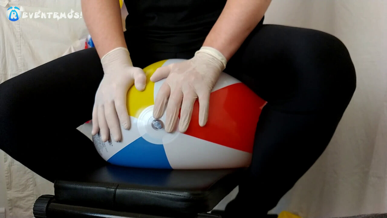 Sit popping and deflating beach balls on a workout bench