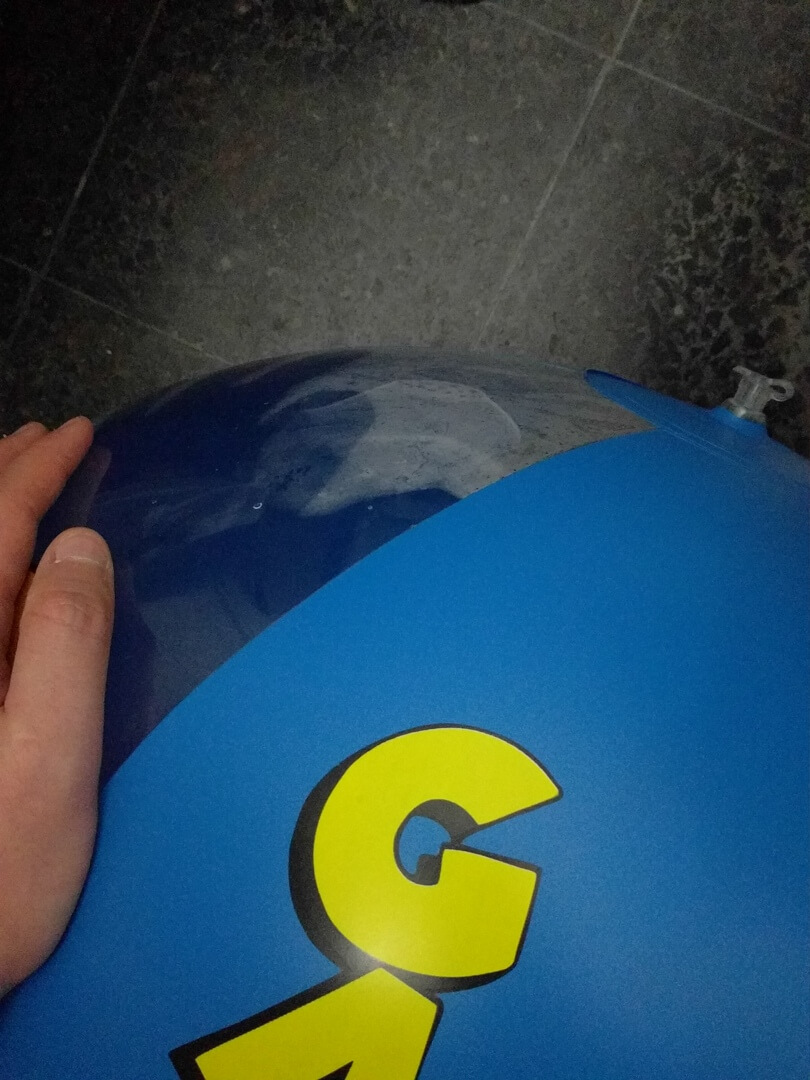 Riding a Garfield beach ball in the bathroom