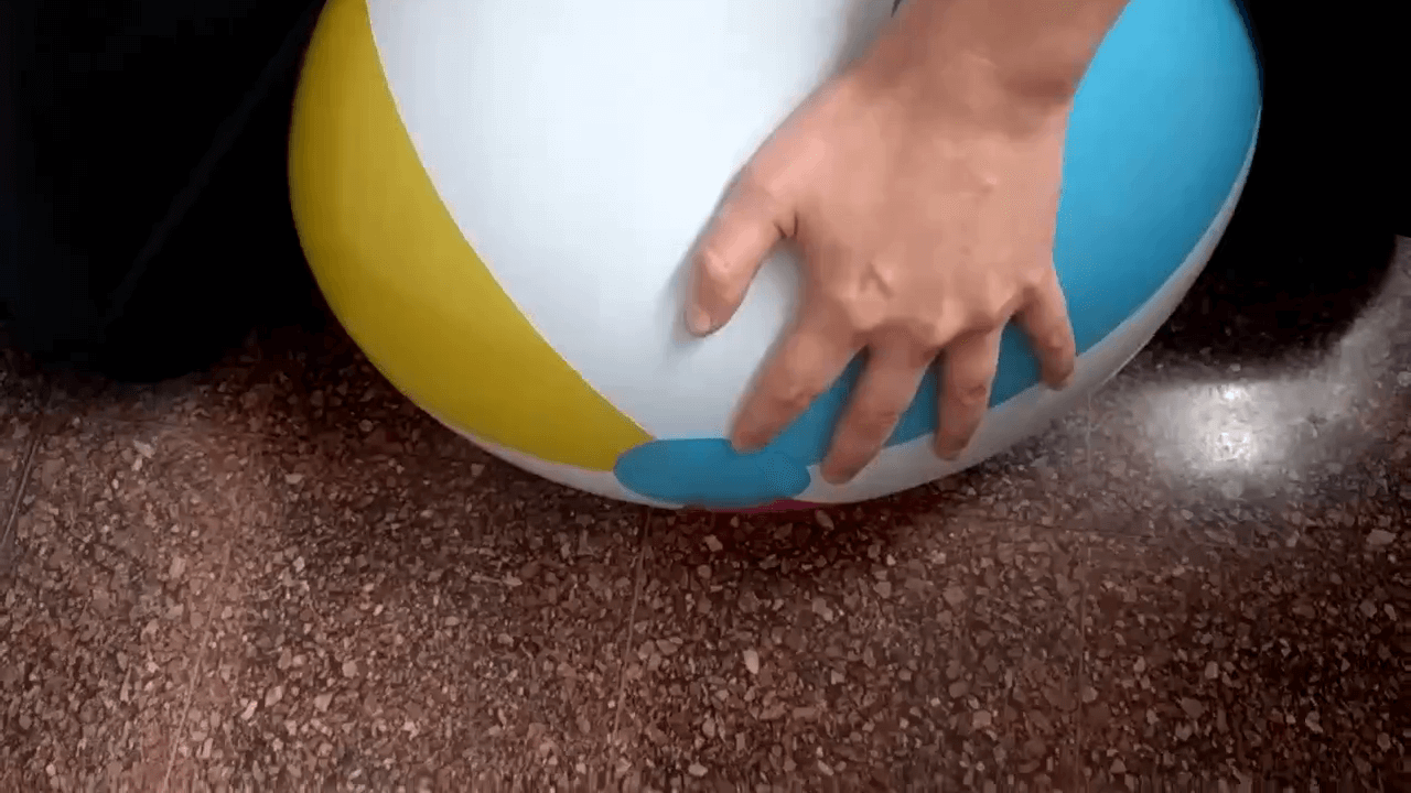 Softly riding a beach ball