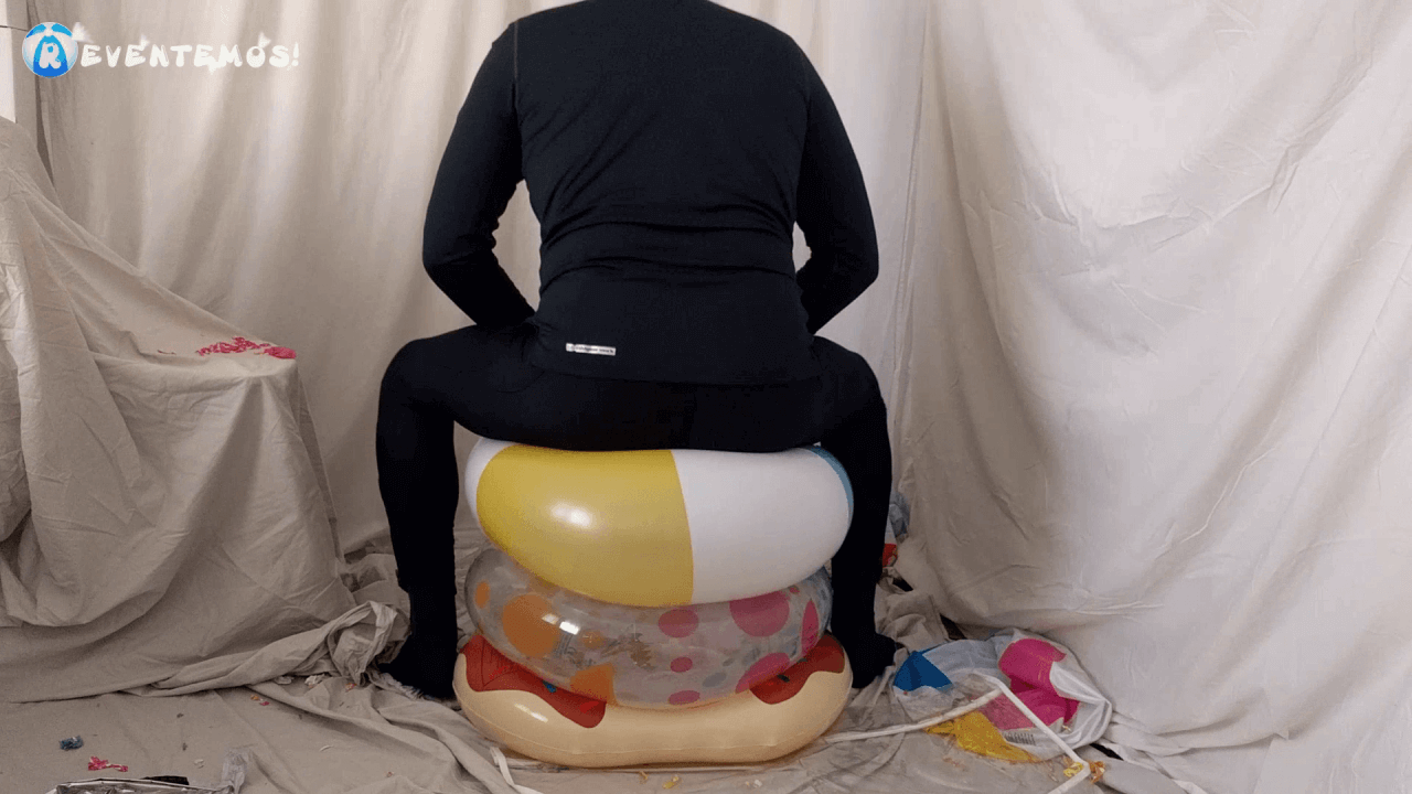 1404. Sit popping beach balls and swimrings on the floor