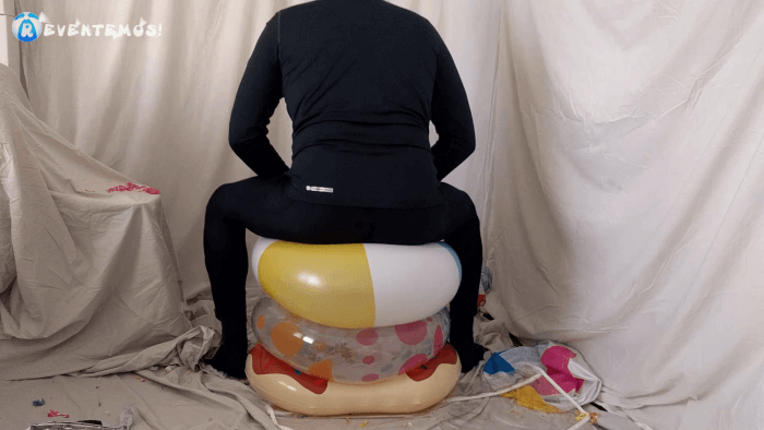 1404. Sit popping beach balls and swimrings on the floor