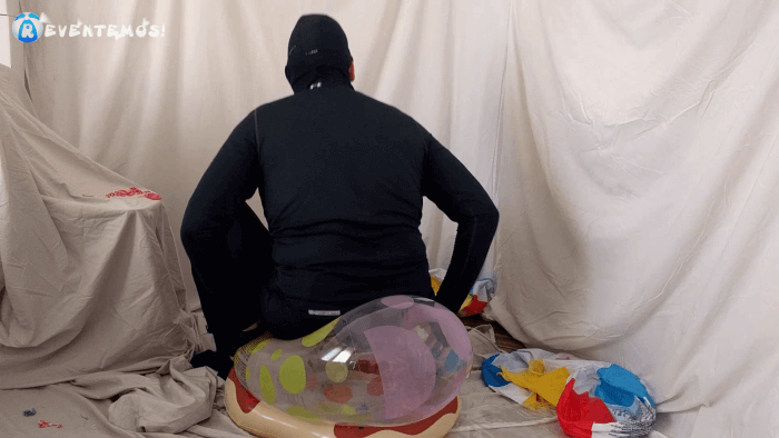 1406. Sit popping beach balls and swimrings on the floor