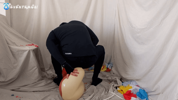 1407. Sit popping beach balls and swimrings on the floor