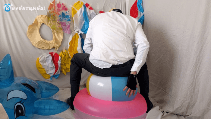 1410. Sit popping beach balls and swimrings on the floor