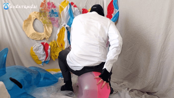 1414. Sit popping beach balls and swimrings on the floor