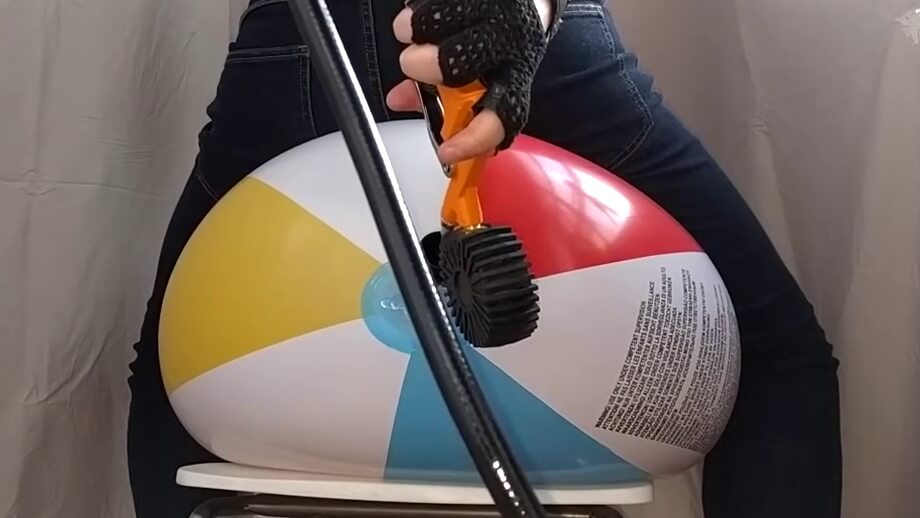 Overinflating and sit popping a 61 inch beach ball
